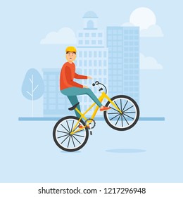 Young guy rides a bike and performs complex stunts.