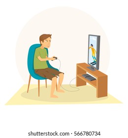Young Guy Sitting and playing games on his big flat television screen