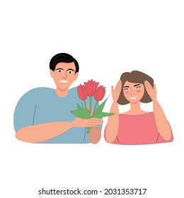  young guy smiles and gives red tulips to a confused girl