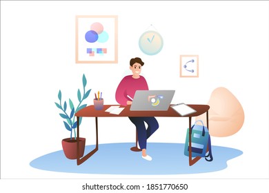 A young guy works at home using a graphics tablet. Work as a designer, remote work. Cozy modern office at home.
