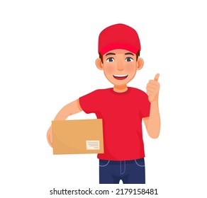 Young handsome delivery man in red cap t-shirt uniform holding box parcel showing thumb up hand gesture
