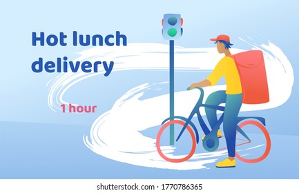 A young handsome guy in a cap is standing with a bicycle at the traffic light with home delivery. Courier en route to your home. Fast delivery on a dynamic background with movement.