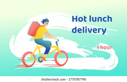 Young handsome guy in sunglasses rides fast with home delivery. The courier on a bicycle at high speed carries products, dynamic background in motion.