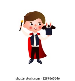 A young handsome magician rehearsing his stunts for his performance. The boy in the clothing of a magician.