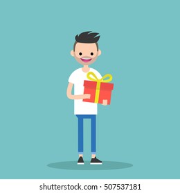 Young happy bearded man holding a bright gift box / editable vector cartoon clip art