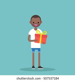 Young Happy Black Man Holding A Bright Gift Box / Editable Vector Cartoon Clip Art