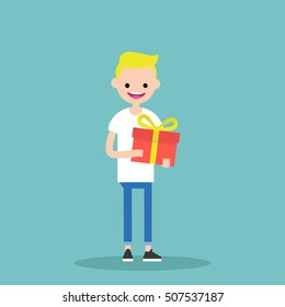 Young happy blond boy holding a bright gift box / editable vector cartoon clip art