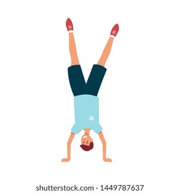 Young happy boy standing on his hands in flat style isolated on white background - vector illustration of smiling caucasian male character upside down dancing at holiday or festive parade.