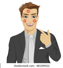 young happy businessman showing red lipstick kiss marks on face