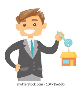 Young happy caucasian white owner holding key to his new house. Smiling buyer with keys and trinket in the shape of house. Vector cartoon illustration isolated on white background. Square layout.