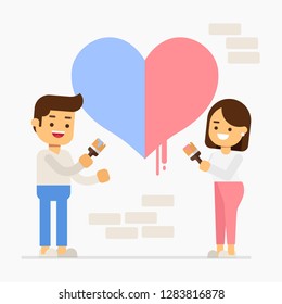 Young happy couple are painting a heart on the wall while doing repair at home. Valentine's Day