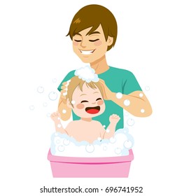 Young happy father bathing his little baby son making bubbles