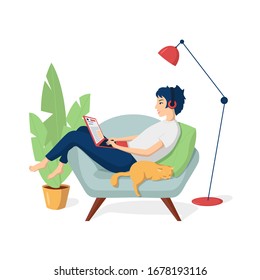 Young happy girl in home clothes is sitting in a chair with a laptop in headphones. A cat is sleeping nearby. Remote work from home. Freelance. Learning on the Internet. Online Store Shopping