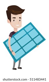 Young happy man holding solar panel in hands. Man with solar panel in hands. Caucasian worker of solar power plant. Green energy concept. Vector flat design illustration isolated on white background.