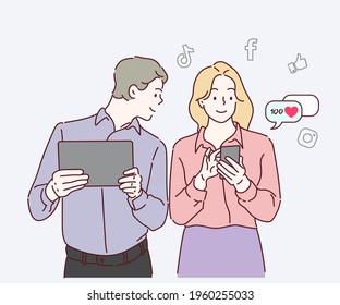 Young happy smiling man and woman standing with phone and tablet, Person using a social media marketing concept. Hand drawn in thin line style, vector illustrations.