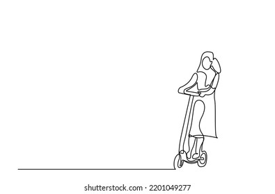 a young healthy beautiful woman rides an electric scooter