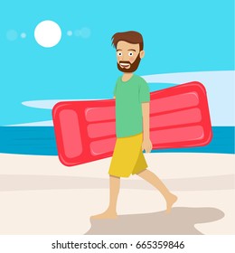 Young hipster man with air mattress walking along the beach