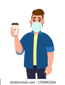 Young Hipster Man Wearing Medical Mask And Holding Coffee Cup. Trendy Person Covering Face Protection From Virus. Male Character Showing Hot Drink Paper Mug. Cartoon Illustration In Vector Style.