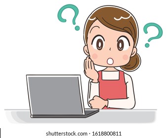 Young housewife wearing red apron.She uses a laptop computer.