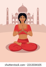 A young Indian girl is doing yoga, sitting in a lotus position on the background of the Taj Mahal