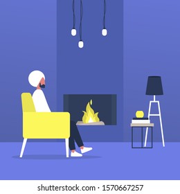 Young indian male character sitting next to a fireplace, modern living room interior