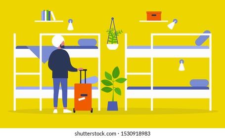 Young Indian Male Traveller Standing With A Suitcase In A Hostel With Bunk Beds