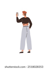 A young individual with short hair is seen taking a selfie with a smartphone, dressed in a crop top and wide-leg pants. Ideal for youth culture, social media, fashion, modern tech, casual style