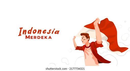 young indonesian celebrating indonesia independence day with waving flag. Merdeka translates to independence or freedom or independent