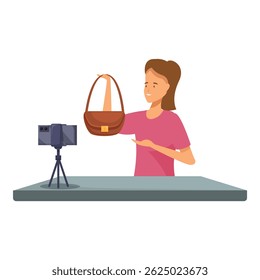 Young influencer woman is recording video blog about fashionable handbag, using smartphone on tripod at home