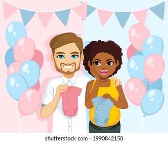 Young interracial couple together on gender reveal party holding blue and pink romper