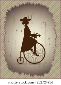 Young lady and retro bike Beautiful lady in a dress and hat riding a vintage bicycle