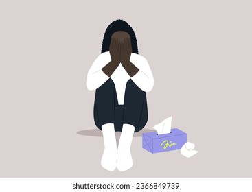 A young, lonely character sits on the floor covering their face, beside them, a box of tissues stands ready for comfort