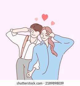 Young loving couple cartoon characters standing. Hand drawn style vector illustrations.