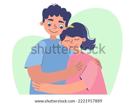 Young loving smiling couple boy and girl standing hugging embracing each other