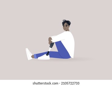 A young male African character with a prosthetic leg sitting on a floor