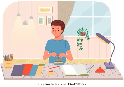Young male character doing DIY. Kid spends time creatively in apartment. Creative pastime at home. Boy makes paper crafts, glues and cuts with scissors. Guy collects toy pyramid, handmade hobby