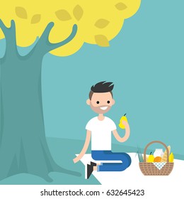 Young male character having a picnic under the tree / flat editable vector illustration, clip art