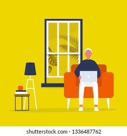 Young male character sitting with a laptop in a living room. Modern office interior. Millennials at work. Flat editable vector illustration, clip art