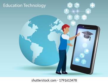 Young male college student touching graduation cap on virtual digital screen smart phone with graphical user interface icons on education technology and globe in light blue background.