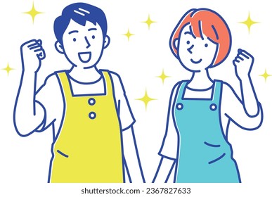 Young male and female caregivers in aprons doing a fist pump