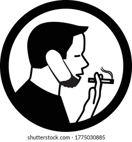 Young male with protective face mask smoking cigarette