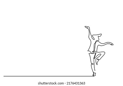 A young male relaxes doing the kung fu karate snake stance move. a person standing with one foot in the air