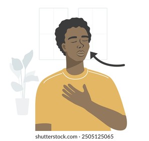 Young male standing and breathing exercise in the home.