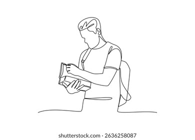Young male student reading book continuous line drawing minimalist design