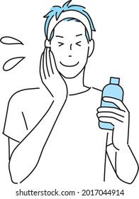 Ein junger Mann, der sich eine feuchtigkeitsspendende Schleife auf das Gesicht aufträgt