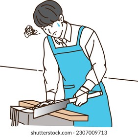 A young man in an apron who is in trouble while cutting wood with a saw
