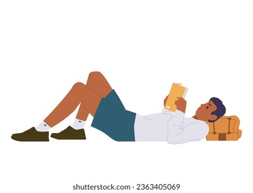 Young man backpacker traveler enjoying reading hobby while rest taking break during hiking trip