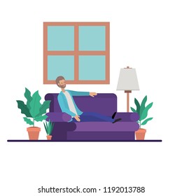 young man with beard seated in the sofa