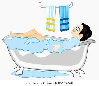 Young man bespectacled takes bath.Young person in bathroom 