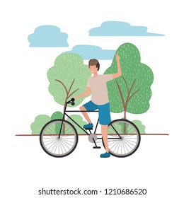 young man with bicycle in landscape